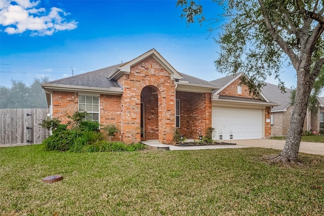 ranch-style home with a garage and a front yard