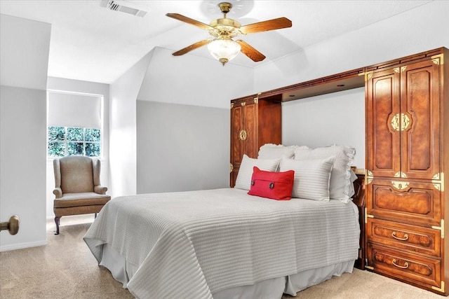 carpeted bedroom featuring ceiling fan and vaulted ceiling