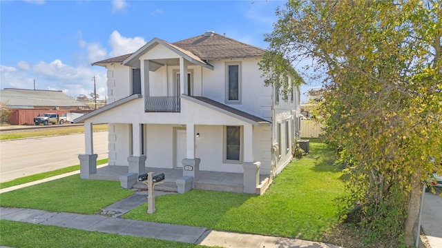 view of front of house featuring a porch and a front yard