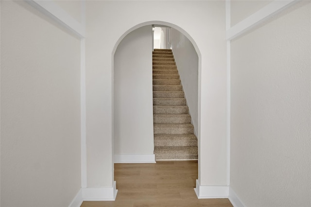 stairway featuring hardwood / wood-style flooring