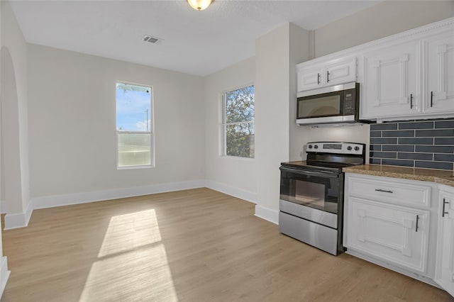 kitchen featuring light hardwood / wood-style floors, white cabinetry, and appliances with stainless steel finishes