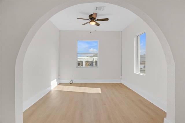 spare room featuring ceiling fan and light hardwood / wood-style floors