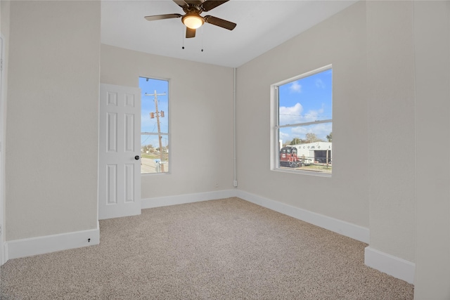 spare room with carpet floors and ceiling fan