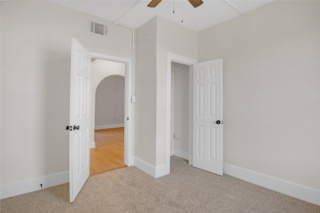 unfurnished bedroom with carpet and ceiling fan