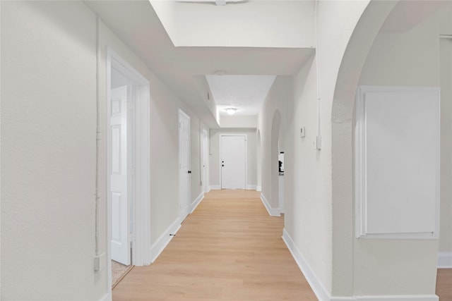 hall with light hardwood / wood-style floors