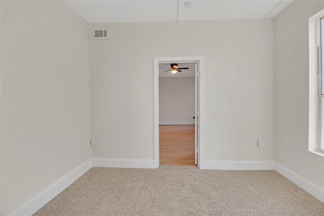 spare room with carpet flooring and ceiling fan