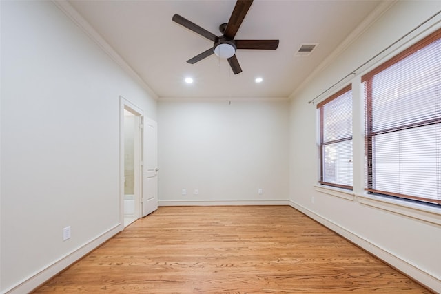 spare room with ceiling fan, light hardwood / wood-style floors, and ornamental molding