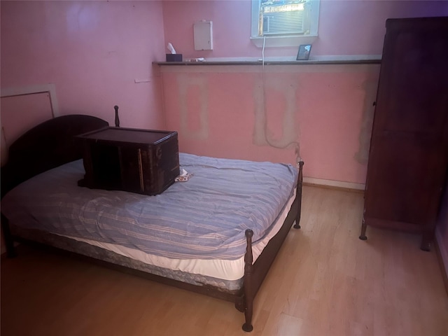 bedroom with light hardwood / wood-style floors