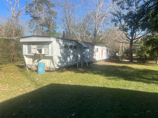 view of side of home featuring a lawn