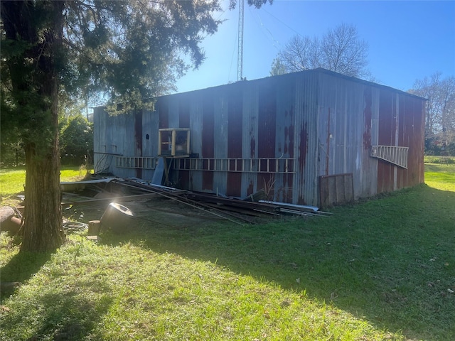 view of outdoor structure with a lawn