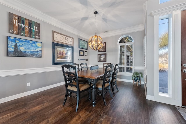 dining room with a notable chandelier, dark hardwood / wood-style flooring, and crown molding