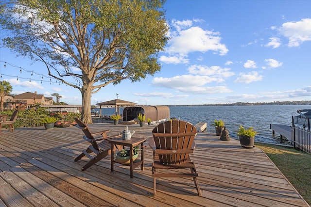 wooden terrace with a water view