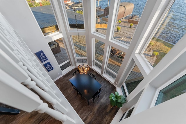 room details featuring a water view and hardwood / wood-style flooring