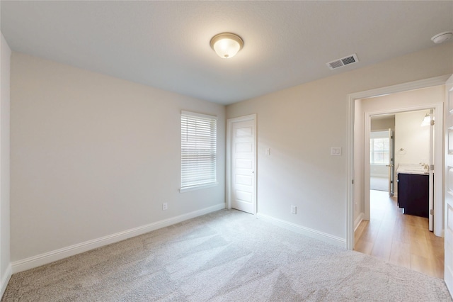 19818 Paros Island Dr, Hockley, TX 77447 - unfurnished room with light colored carpet and a smoke detector