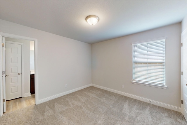 19818 Paros Island Dr, Hockley, TX 77447 - empty room with light colored carpet and baseboards