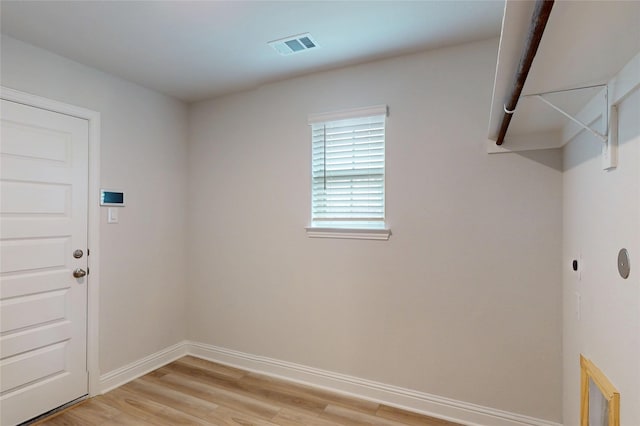 19818 Paros Island Dr, Hockley, TX 77447 - washroom with light wood-type flooring and baseboards