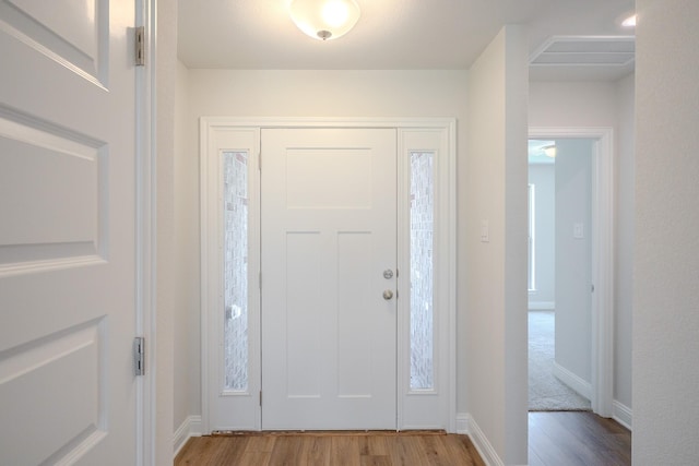22207 Kastoria Dr, Hockley, TX 77447 - foyer entrance featuring wood finished floors and baseboards