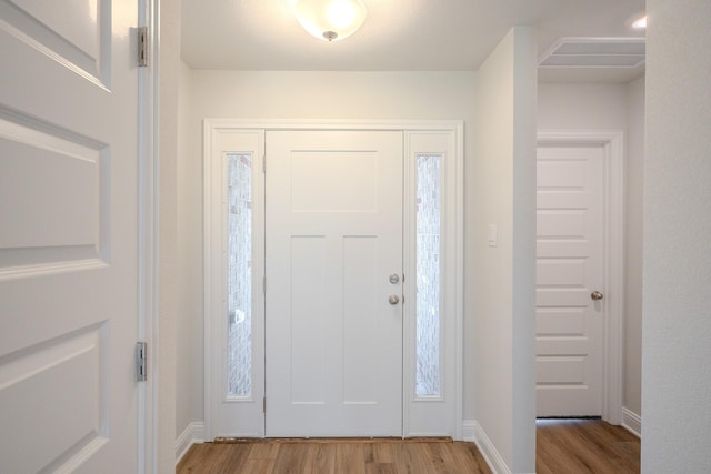 22207 Kastoria Dr, Hockley, TX 77447 - foyer entrance featuring light wood finished floors and baseboards