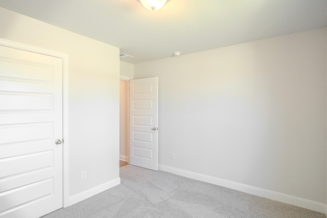 22207 Kastoria Dr, Hockley, TX 77447 - unfurnished bedroom featuring light colored carpet and baseboards