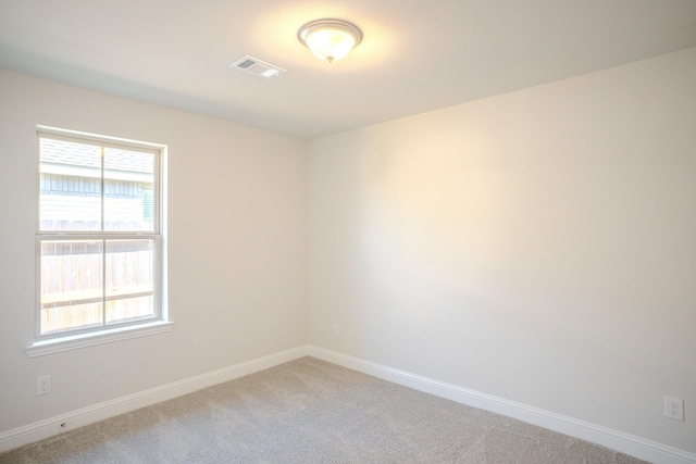 22207 Kastoria Dr, Hockley, TX 77447 - empty room featuring baseboards and light carpet