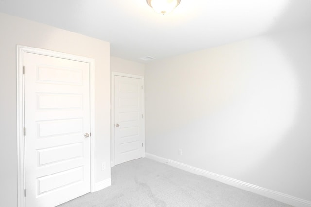22207 Kastoria Dr, Hockley, TX 77447 - unfurnished bedroom featuring light carpet and baseboards
