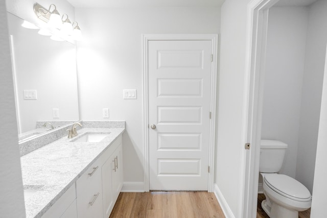 22207 Kastoria Dr, Hockley, TX 77447 - bathroom featuring double vanity and wood finished floors