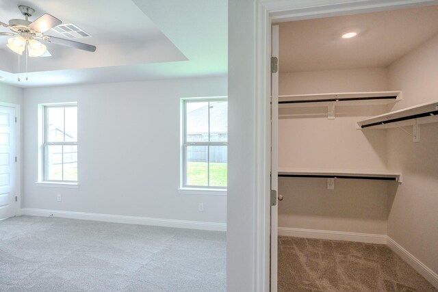 22207 Kastoria Dr, Hockley, TX 77447 - walk in closet featuring carpet and ceiling fan