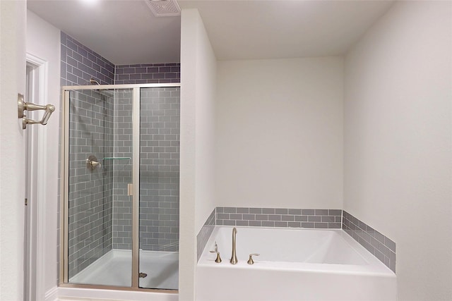 19814 Paros Island Dr, Hockley, TX 77447 - bathroom with a bath and a shower stall