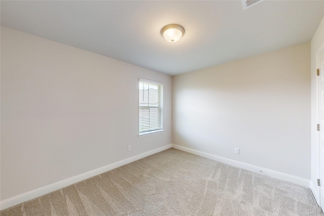 19814 Paros Island Dr, Hockley, TX 77447 - spare room featuring carpet and baseboards