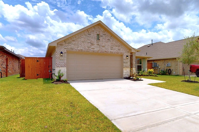 19814 Paros Island Dr, Hockley, TX 77447 - single story home with brick siding, concrete driveway, a garage, and a front yard