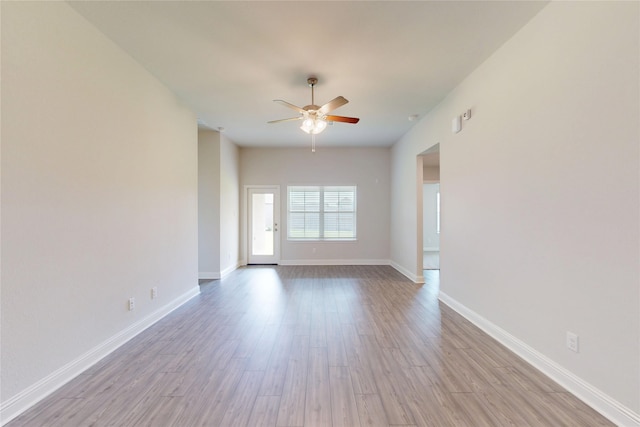 19814 Paros Island Dr, Hockley, TX 77447 - empty room featuring a ceiling fan and wood finished floors