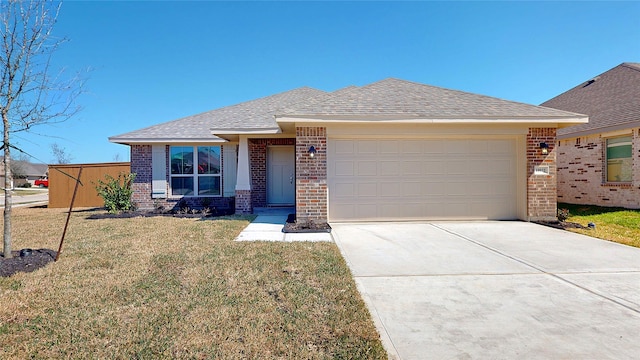 view of front of property with brick siding, a shingled roof, a garage, driveway, and a front lawn