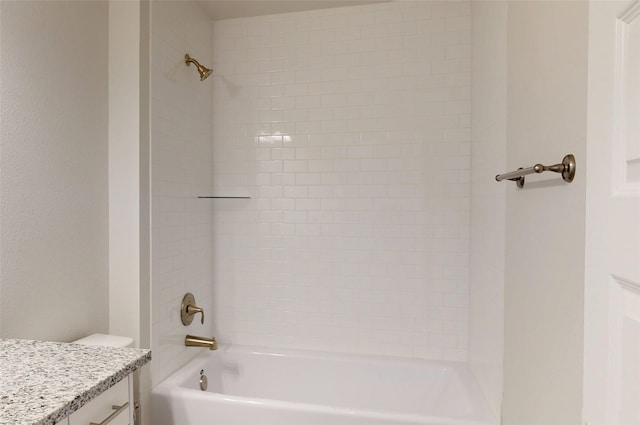 bathroom featuring shower / bathtub combination and vanity