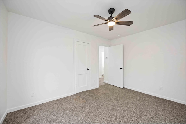 unfurnished room with carpet flooring and ceiling fan