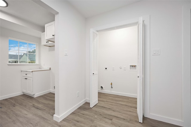 washroom with hookup for a washing machine, light hardwood / wood-style flooring, gas dryer hookup, and electric dryer hookup