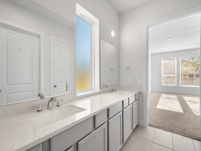 bathroom with tile patterned floors and vanity