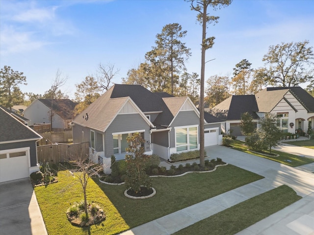 view of front of home featuring a garage and a front lawn