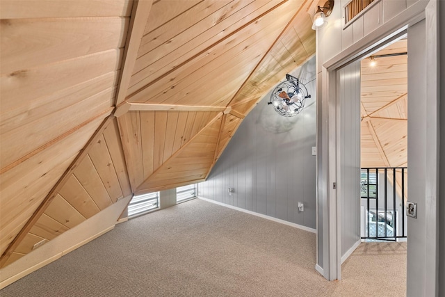 bonus room with carpet, a wealth of natural light, and wooden ceiling