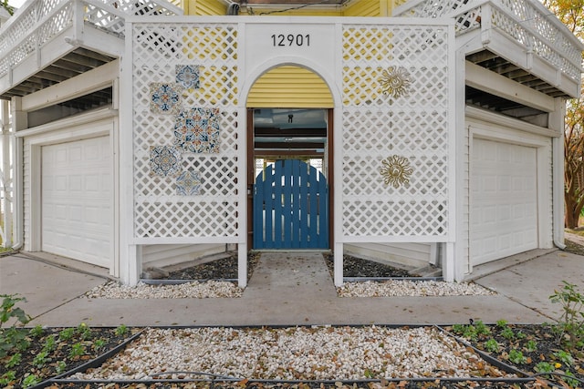 view of exterior entry with a garage