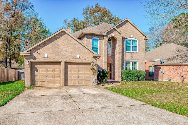 front facade featuring a front yard and a garage