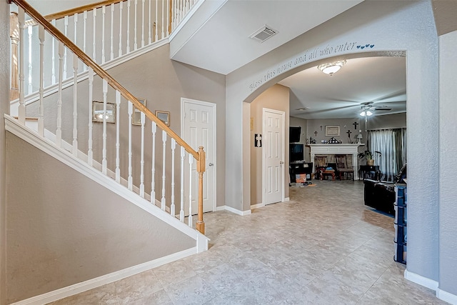 entrance foyer with ceiling fan