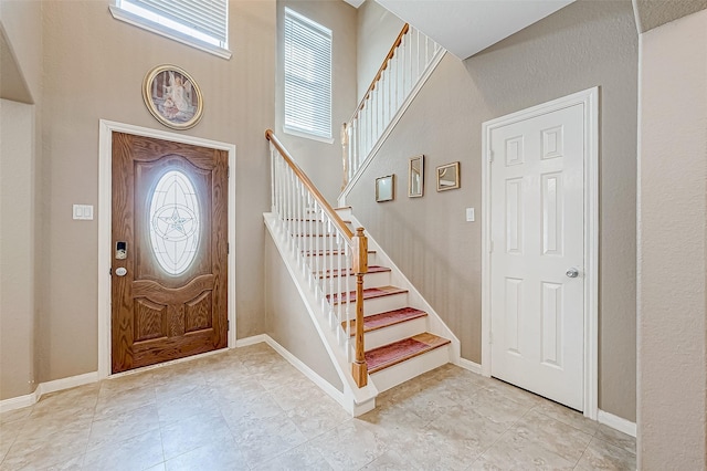 foyer entrance featuring light tile patterned floors