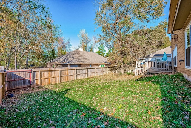 view of yard with a deck