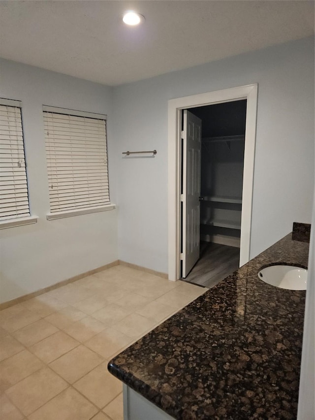 bathroom featuring tile patterned floors and vanity