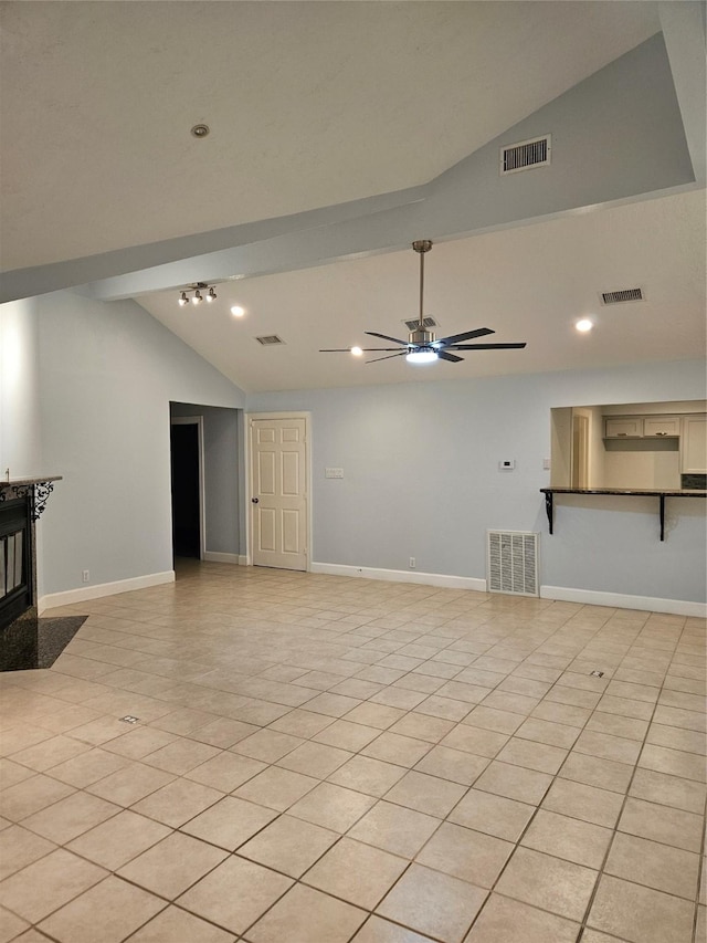 living room with light tile patterned floors, ceiling fan, and lofted ceiling