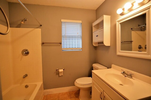 full bathroom featuring tile patterned flooring, vanity, toilet, and washtub / shower combination