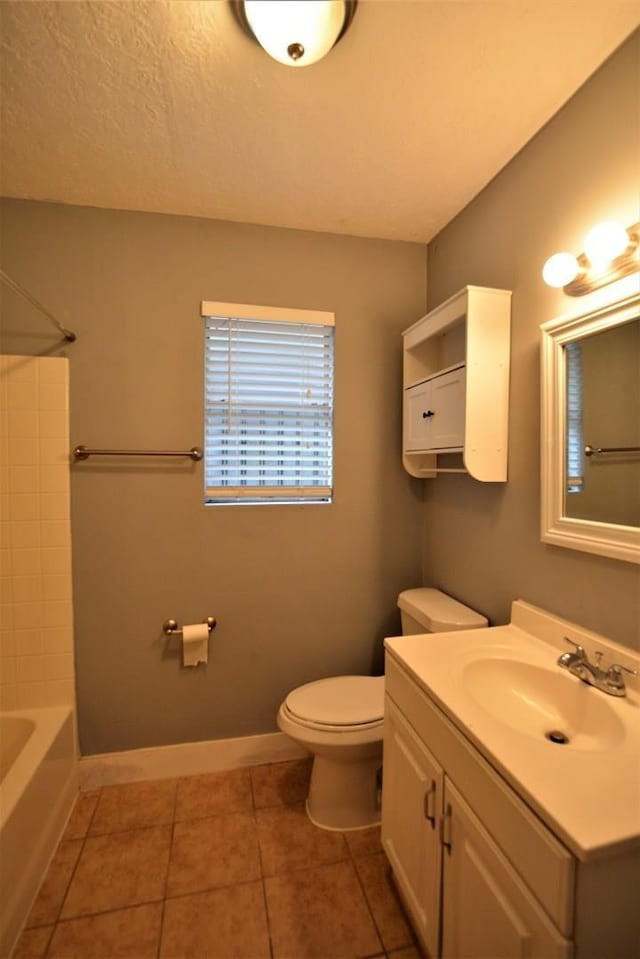 full bathroom featuring toilet, bathtub / shower combination, vanity, and tile patterned floors