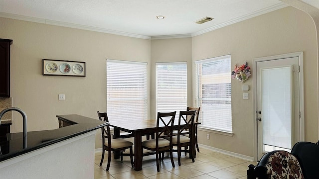 tiled dining space with ornamental molding