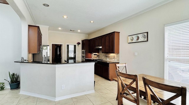 kitchen with decorative backsplash, kitchen peninsula, dark brown cabinetry, crown molding, and light tile patterned floors