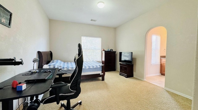 bedroom with light colored carpet